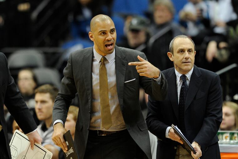 Ime Udoka (left) yells toward the Spurs players during a January 2015 game.