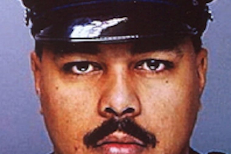 Officer Mariano Santiago, 44, shot in shoulder during chase.