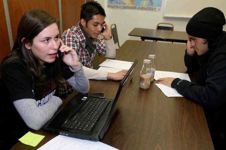 At the Nationalities Service Center, Maria Marroquin, with Mark Cortez (center) and David Ramirez, urging support for the Development, Relief, and Education for Alien Minors Act.