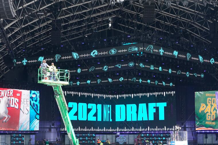 Workers continue preparing the NFL Draft Theatre for the 2021 NFL Draft in Cleveland. Fans seated in the amphitheater must be vaccinated.