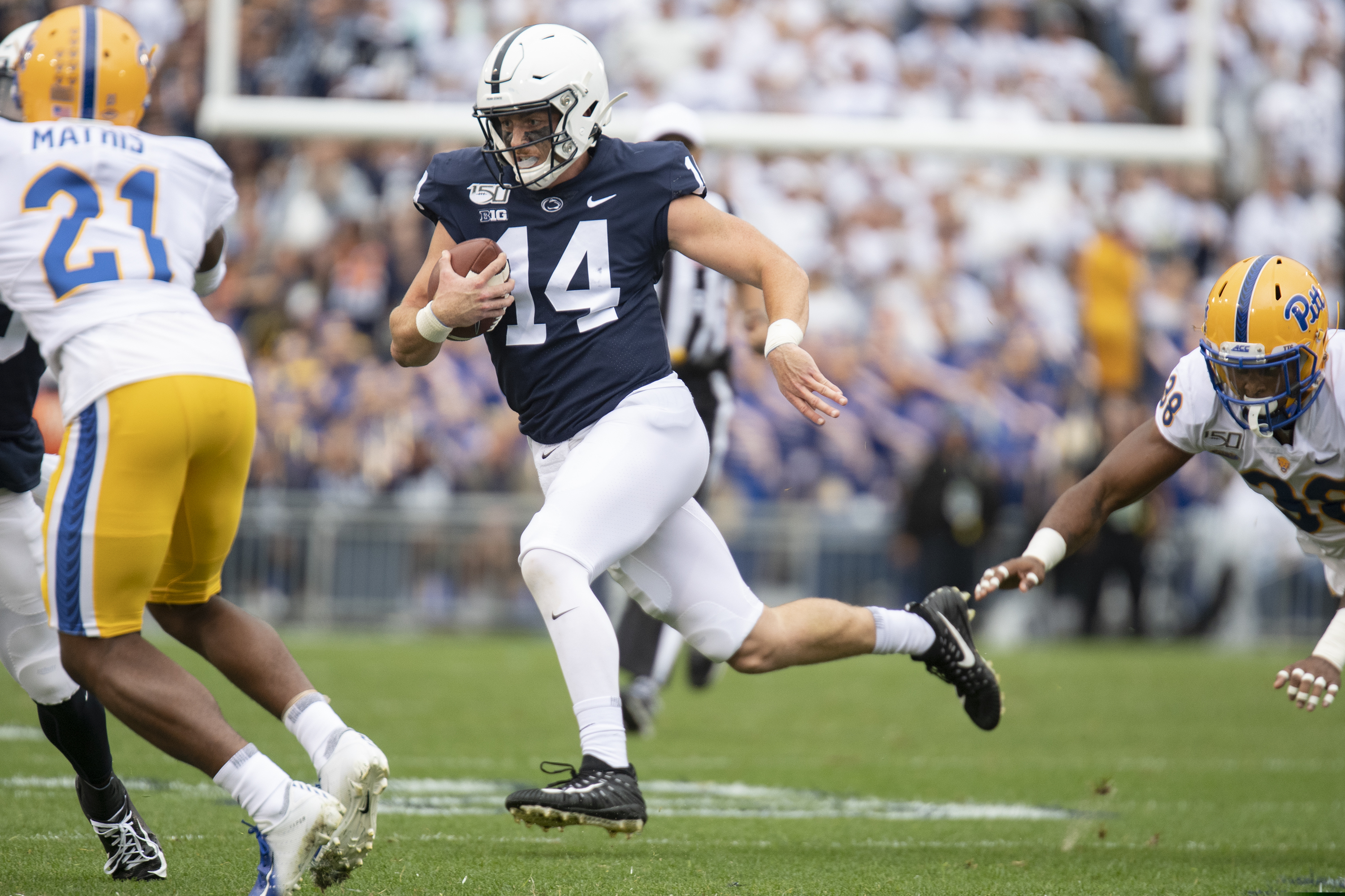 Penn State quarterback Sean Clifford gains yardage on a run in the second quarter against Pittsburgh.