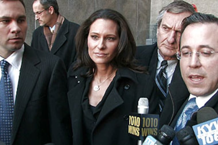 The assault charge against former CBS3 anchor Alycia Lane was dropped today at hearing in New York. Her boyfriend Chris Booker (left) was there to support her.