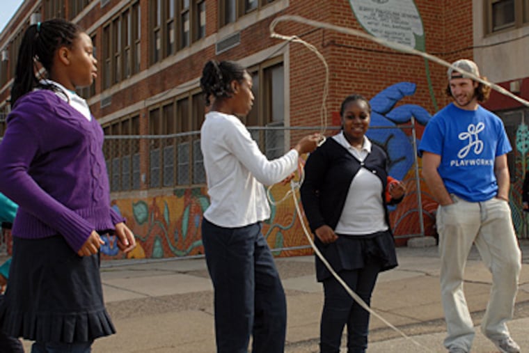 Coach" Ben Gibboney talks with students, including fifth-grader Myjae Harris (far left) during recess March 8, 2011 at the Charles Drew School. ( Tom Gralish/Staff Photographer )
