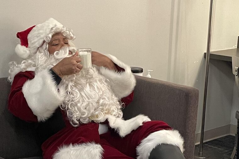 After the Philadelphia Orchestra's original Santa had to go in COVID-19 quarantine, principal librarian Nicole Jordan stepped in to fill Santa's boots.