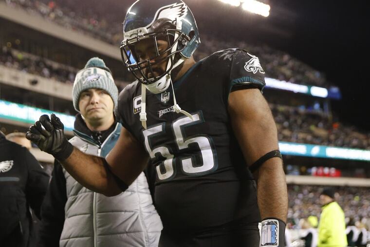 Eagles defensive end Brandon Graham leaves the field after injuring his ankle against the Oakland Raiders on Christmas night.