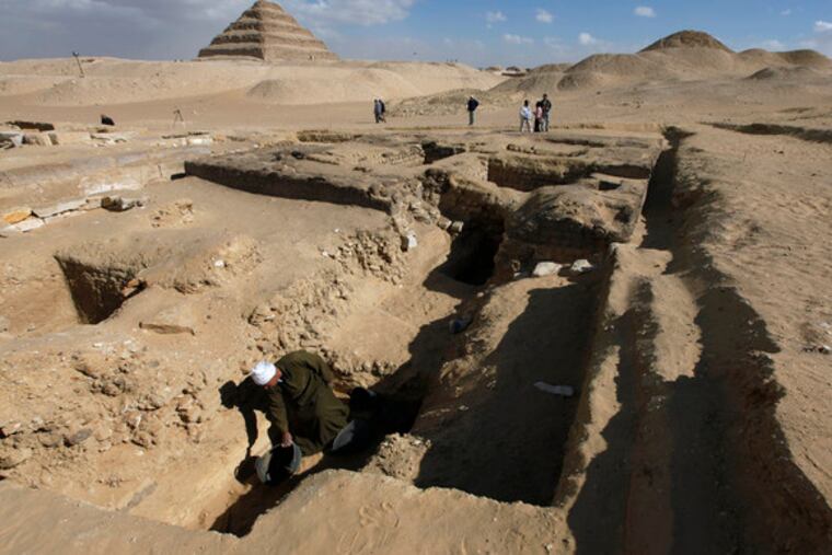 A worker toils in excavations at the Saqqara burial site south of Cairo. Newfound 4,300-year-old tombs are the beginning of a large cemetery, according to Egypt's top archaeologist.