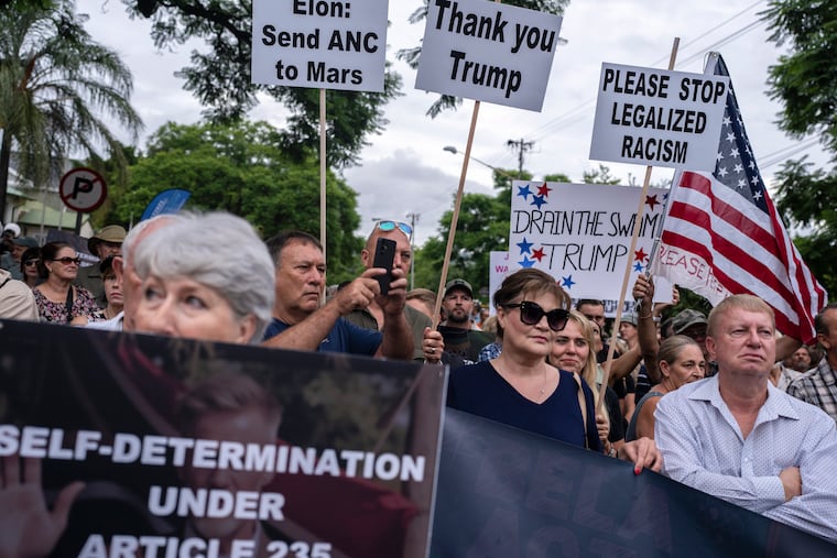 FILE — White South Africans rally outside the U.S. embassy in Pretoria, South Africa, Feb. 15, 2025. President Donald Trump has instituted the most dramatic retrenchment of the country’s refugee program in decades, largely walling off the United States to anyone fleeing war and persecution.But Trump has made one notable carve out: Since last year, Afrikaners, the white minority from South Africa, have had the rare ability to seek refugee status. (Joao Silva/The New York Times)