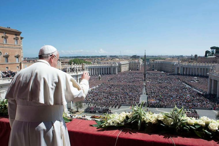 Pope Francis delivers his benediction at the end of Easter Mass in St. Peter's Square. He called for peace in Ukraine and Syria, an end to terror in Nigeria, and more attention to the needy.