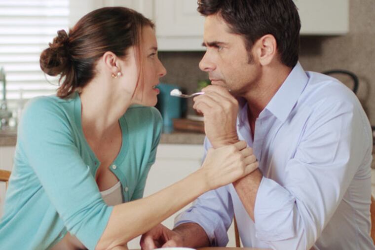 This advertisement provided by Dannon Co,. shows a scene from the Dannon Oikos Greek Yogurt Super Bowl commercial, starring Jessica Blackmore and John Stamos. The Dannon Oikos advertisement will run during the third quarter of Super Bowl XLVI, Sunday, Feb 5, 2012. (AP Photo/Dannon Co.)