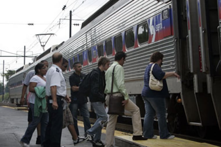 Afternoon commuters board the R5 Paoli/Thorndale train at the Downingtown SEPTA rail station on Wednesday afternoon. SEPTA plans to expand service. (Laurence Kesterson / Inquirer)