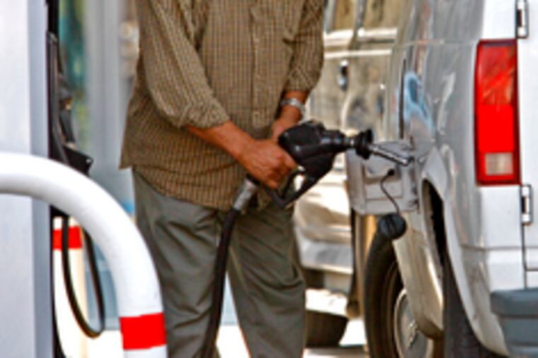 Filling up at Delaware Avenueand Spring Garden Street. Philadelphia-area gasoline prices fell 2.7 percent between August and September.