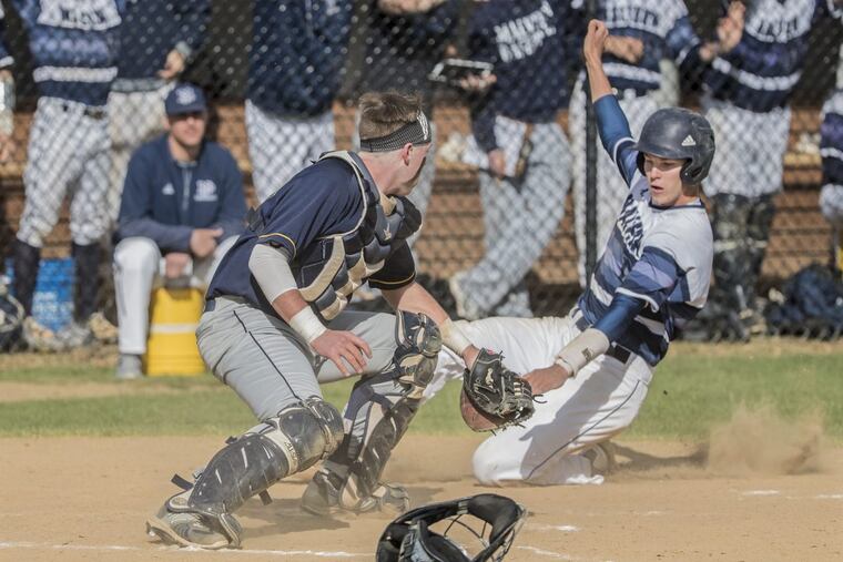 Malvern’s Brady Devereux is tagged out by Penn Charter catcher, Gavin Zavorski last season. ,
