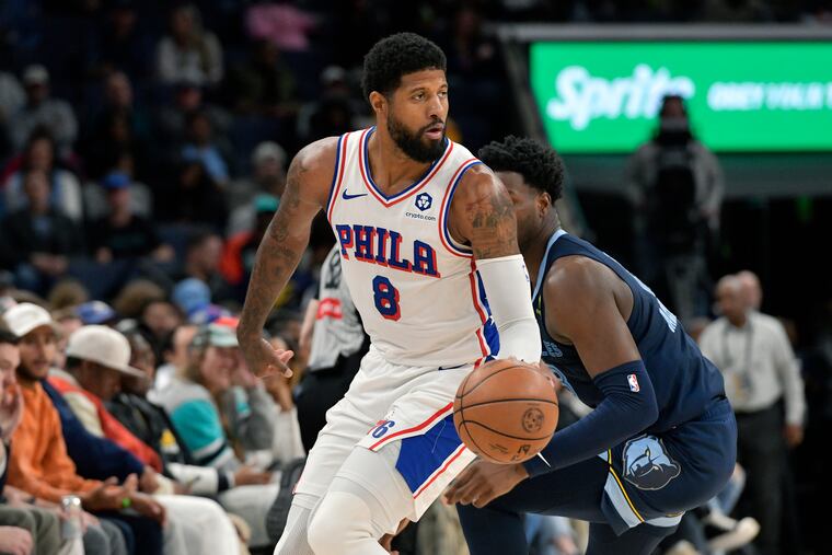 Sixers forward Paul George moves the ball upcourt ahead of Memphis' Jaren Jackson Jr. on Wednesday.