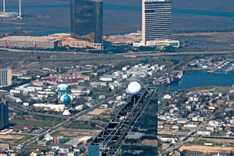 Management at the Borgata casino, in the background, argue that it should not be included in an improvement district that most benefits Boardwalk casinos, including the new Revel, in the foreground. CLEM MURRAY / Staff Photographer, file