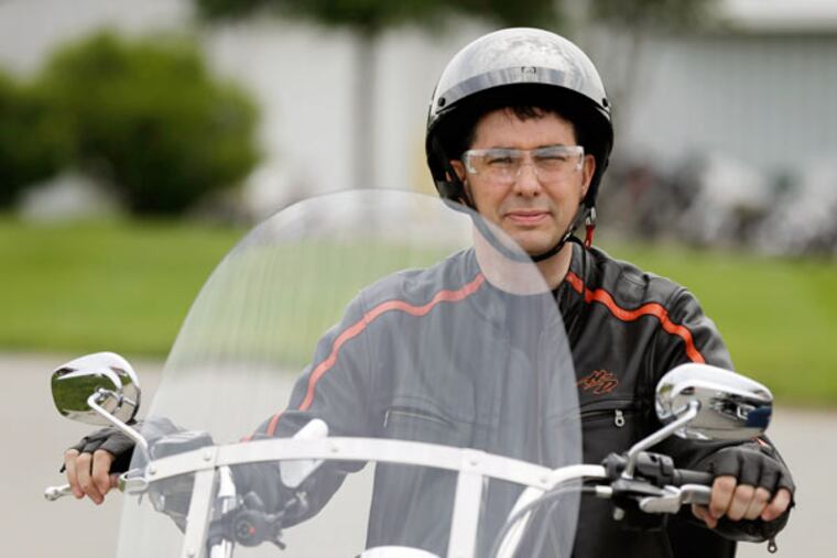 In June, when he participated in a fund-raising ride for an Iowa senator, Wisconsin Gov. Scott Walker held a big Iowa Poll lead over other candidates. (AP Photo/Charlie Neibergall)