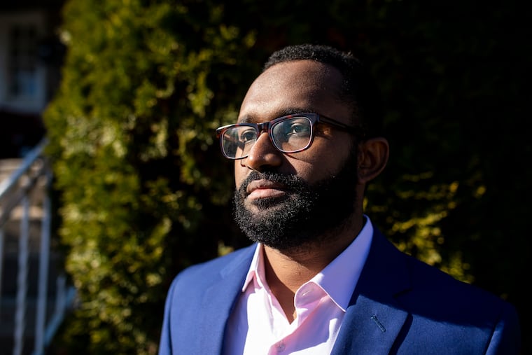 Ahmed Elhashemy, 30, of Sudan, poses for a portrait at his home in Upper Darby.
