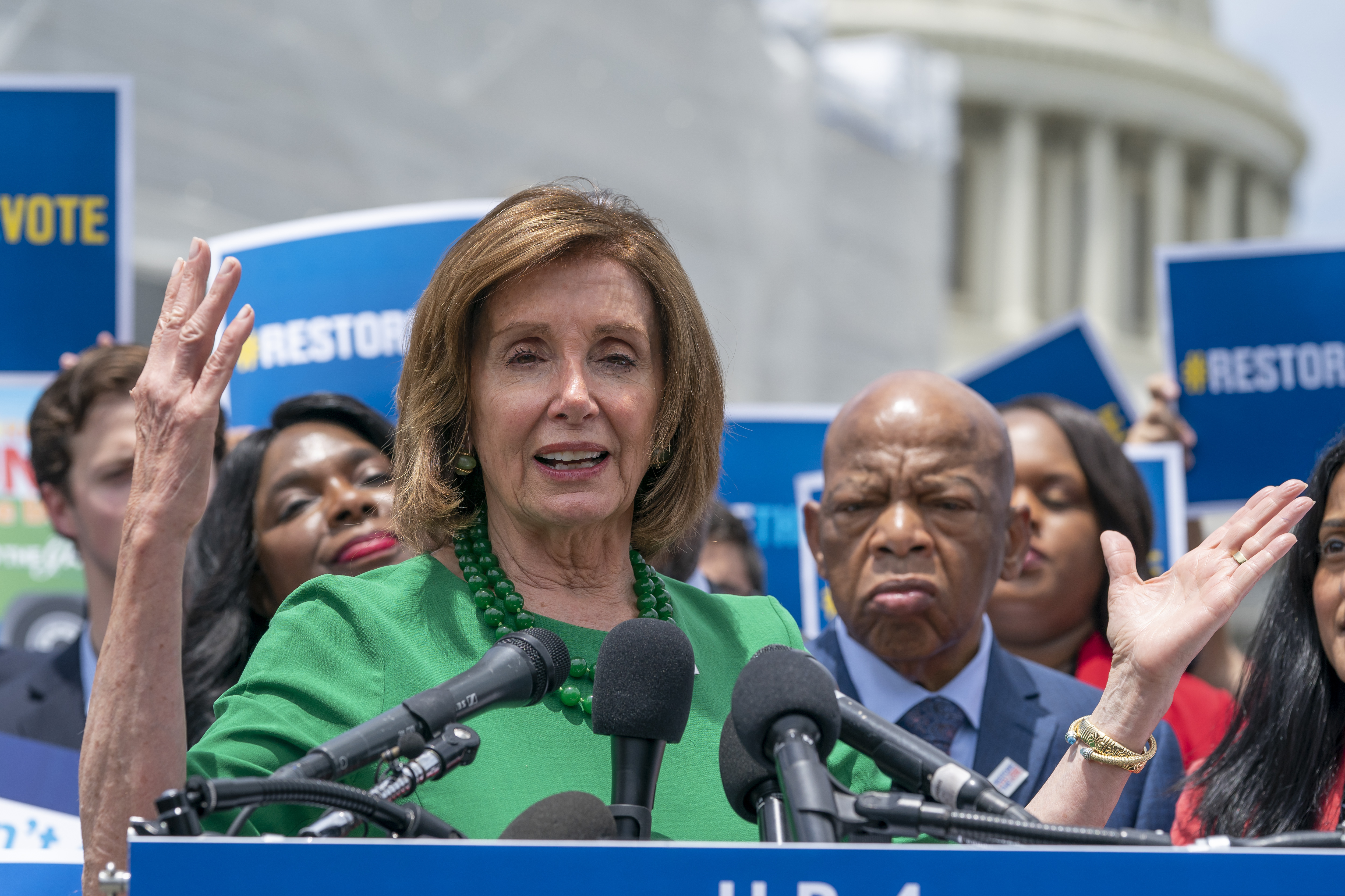 Speaker of the House Nancy Pelosi (D., Calif.), flanked by Rep. Terri Sewell (D., Ala.) and Rep. John Lewis (D., Ga.), talks to reporters about the need for the Voting Rights Advancement Act of 2019, at the Capitol in Washington, Tuesday, June 25, 2019.