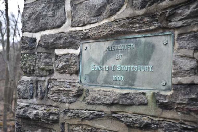 A dedication plaque is embedded in one of the stone piers at Lincoln Drive and Johnson Steets in Mt. Airy that Patrick Morand hopes to restore. (RON TARVER /Staff Photographer )