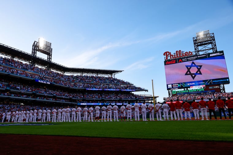 The Israeli flag is displayed on the screen before Game 3 of a National League Division Series baseball game between the Atlanta Braves and the Philadelphia Phillies Wednesday, at Citizens Bank Park.