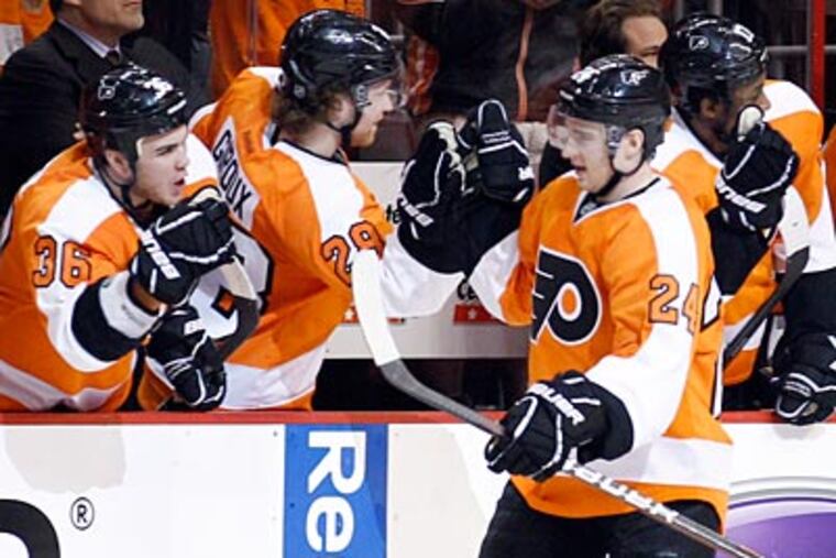Matt Read celebrates his power-play goal in the second period. (Yong Kim/Staff Photographer)