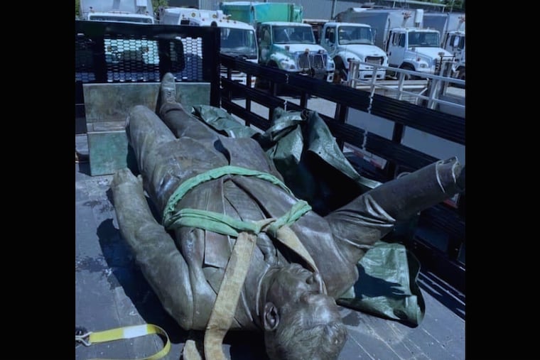 A photo of the Frank Rizzo statue in the back of a flatbed truck at an undisclosed city facility was included in a lawsuit by Rizzo supporters who want to take possession of the statue.