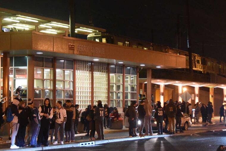 PATCO passengers at the Ferry Avenue station late Sunday night after a train broke down.