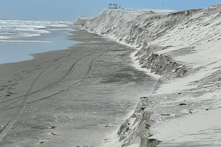 A view of the beach in North Wildwood taken from Seventh Avenue looking South. The cliffs are actually stockpiles of sand North Wildwood was ready to spread as part of a beach replenishment project. The cliffs had been rounded mounds of sand, until about a third of which was lost during the storm that surged May 6 to 8, 2022.