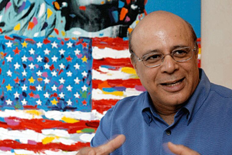 Sanford A. Ibrahim, CEO of Radian Group, Inc., in his Center City office, a painting by local artist John Stango behind him. "At a time like this, you can't lose your balance, he says.