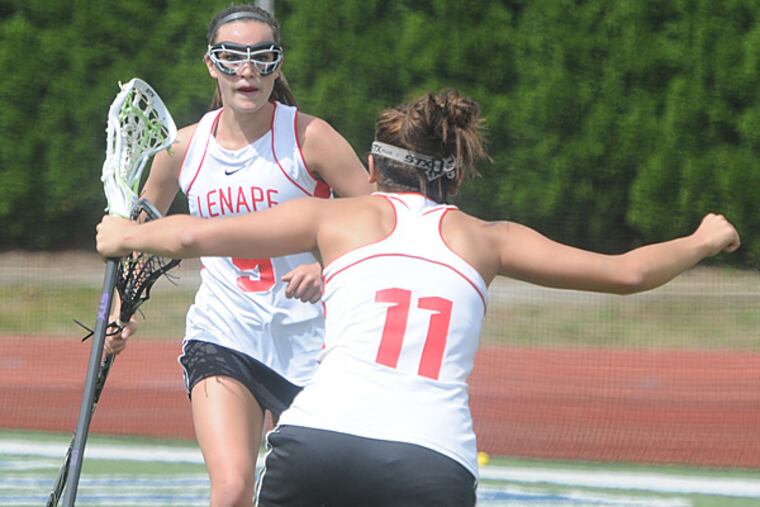 Rena Carabases runs to congratulate Nicole Donnelly (9), who scored for Lenape to make it 10-9 over Ridge. (Photo/Curt Hudson)