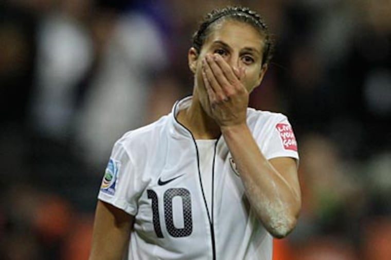 U.S. midfielder Carli Lloyd reacts after missing during the penalty shoot-out of the Women’s World Cup. (Frank Augstein/AP)
