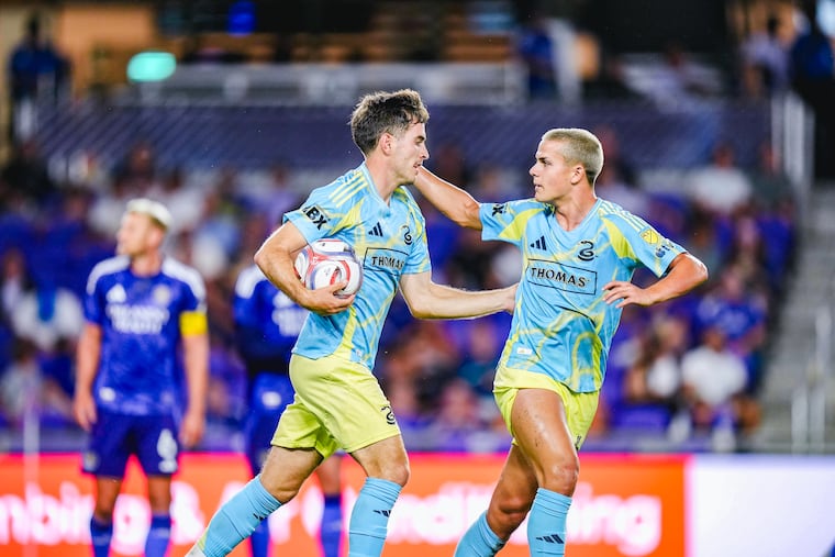 Union's Milan Iloski (left) celebrates with Cavan Sullivan after scoring a goal in Wednesday's game against Orlando City.
