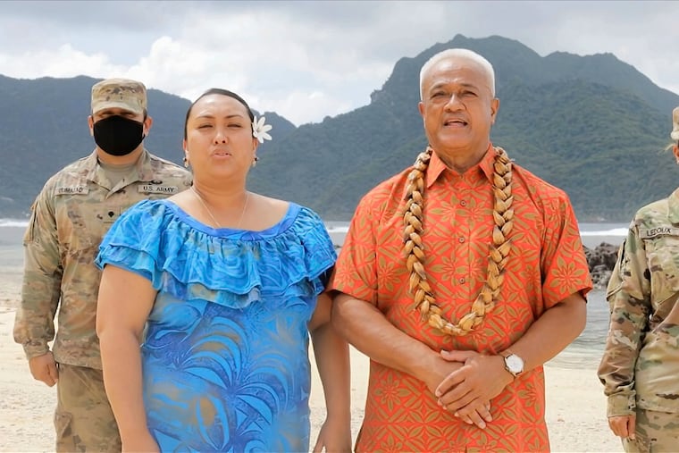 Aliitama Sotoa and Petti Matila of American Samoa speak during the state roll call vote on second night of the Democratic National Convention.