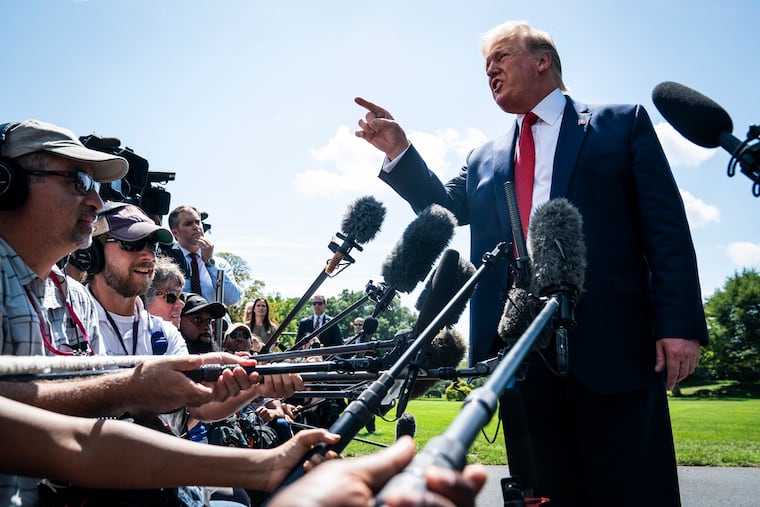President Donald Trump talks to reporters outside the White House on Wednesday. MUST CREDIT: Washington Post photo by Jabin Botsford