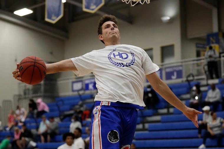 Blue team member Blaise Vespe goes up for a dunk while warming up before the Philadelphia All-American basketball game in the Mirenda Center at Neumann University on May 27.