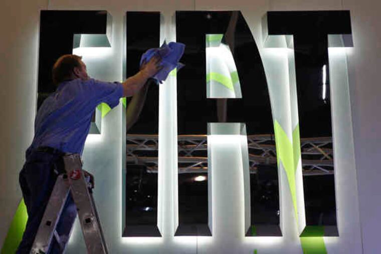 The Fiat logo was clean and spiffy for the recent International Auto Show in Geneva, Switzerland. U.S. analysts say the Italian automaker could leaven Chrysler's lineup with smaller, fuel-efficient models.