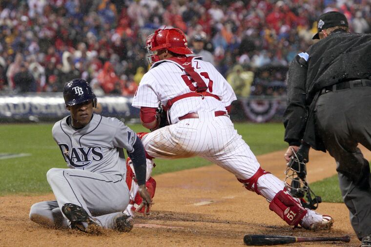 B.J. Upton sliding home with the tying run in the sixth inning of Game 5 of the 2008 World Series, beating the tag by Phillies catcher Carlos Ruiz. The game was halted shortly thereafter.