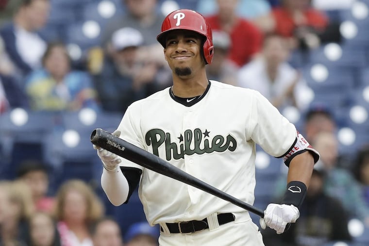 Aaron Altherr grimaces after striking out swinging to end the eighth inning on Sunday.