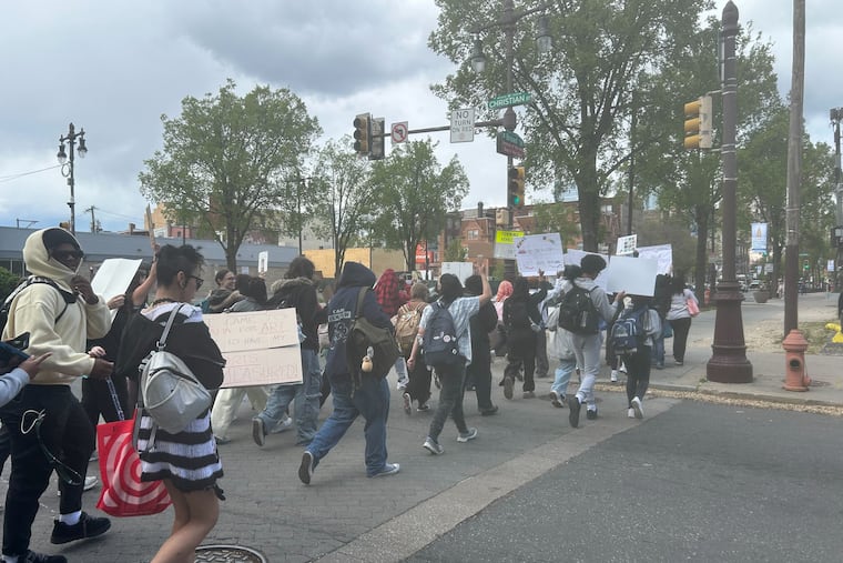 Students march up Broad Street after walking out of Philadelphia High School for Creative and Performing Arts, known as CAPA, on Monday, April 20, 2026, in protest over enforcement of the school's dress code. Female students say school administrators are unfairly policing girls' bodies.