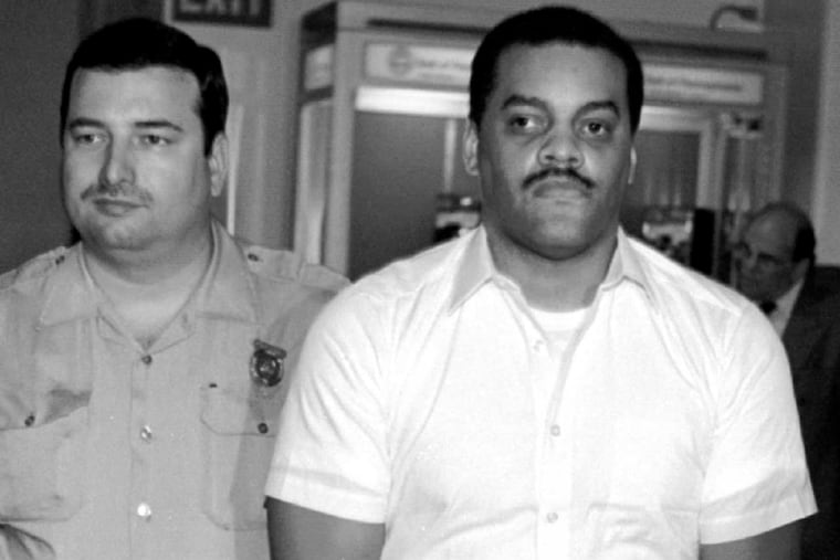 David Dickson is taken to courtroom 625 in City Hall for his hearing on the murder of a female Drexel University student for her shoes.