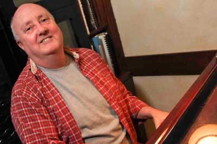 John Bickle regularly plays piano at Knock, a Center City restaurant. (Steven M. Falk / Staff)