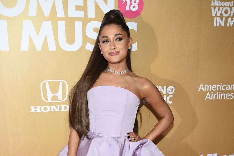 FILE - In this Dec. 6, 2018, file photo, Ariana Grande attends the 13th annual Billboard Women in Music event in New York. Grammys producer Ken Ehrlich says the show had multiple conversations with Grande about performing at the awards show on Sunday but the singer “felt it was too late for her to pull something together.” (Photo by Evan Agostini/Invision/AP, File)