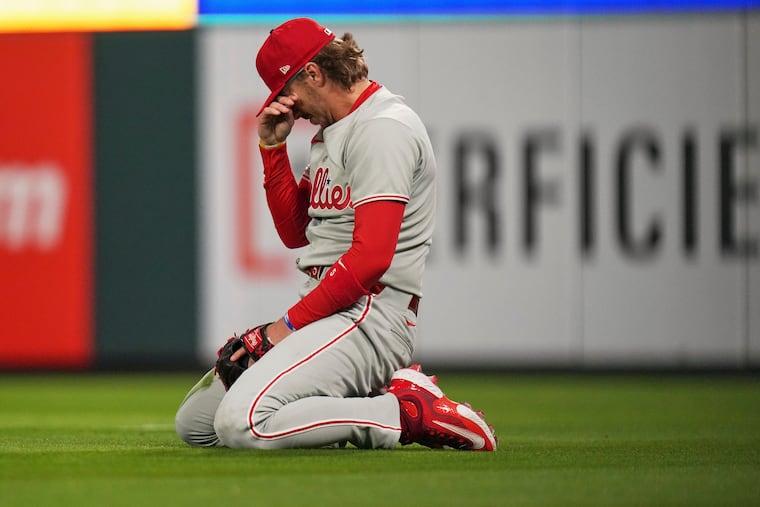 Phillies second baseman Bryson Stott reacts after missing a catch on a single by St. Louis Cardinals' Yohel Pozo.