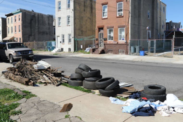 The 2000 block of North Third Street, near Diamond Street, is a popular dumping site for tires and other refuse. (Clem Murray / Staff Photographer)
