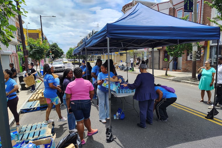PA General Assembly speaker Jonna McClinton, center, arrives for a food giveaway her office hosted at 60th & Walnut streets, July 18, 2025.