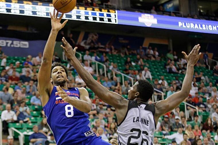 San Antonio Spurs Cady Lalanne (26) defends against Philadelphia 76ers Jahlil Okafor (8) as he shoots during the second half of an NBA
summer league basketball game Monday, July 6, 2015, in Salt Lake City. (Rick Bowmer/AP)