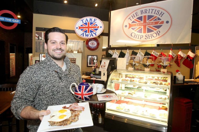 Edward Strojan, owner of the British Chip Shop, in 2012 with a plate full of bubble and squeak with eggs and a pot of tea.