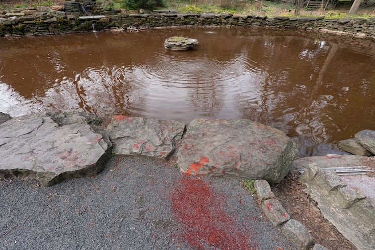 The Penn Bio Pond at James Kaskey Memorial Park, Wednesday, March 22, 2023. Vandals dyed the Penn Bio Pond red over the weekend.