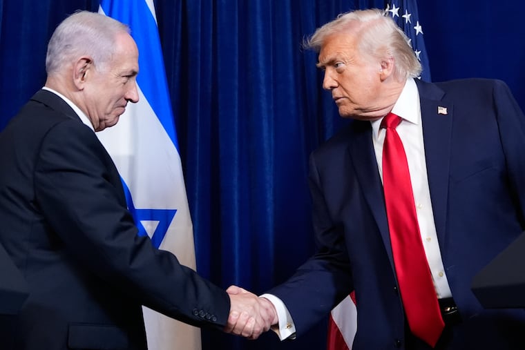 FILE - President Donald Trump shakes hands with Israel's Prime Minister Benjamin Netanyahu during a news conference at Mar-a-Lago, Dec. 29, 2025, in Palm Beach, Fla.