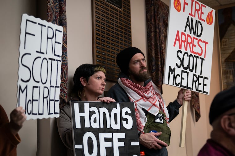 Bonnie Koehler (center) looks on before speaking during a council meeting as members of the community speak out against the actions of Police Chief Scott McElree on March 4 in Quakertown.