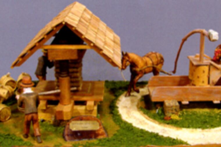 "Processing Apple Cider - Summer" is among eight carved folk-art dioramas by John Dale being offered by Alderfer's. They are expected to sell in the mid-three-figure range.